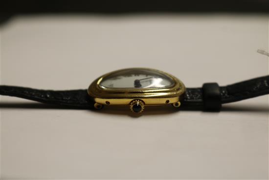 A ladys 18ct gold Cartier oval cased wrist watch, with Cartier box.